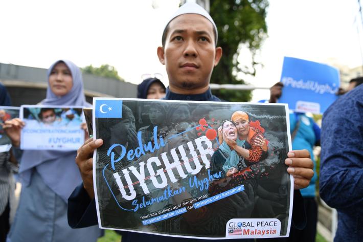 People take part in an event in front of the Chinese embassy in Kuala Lumpur in solidarity with the Uyghur community in China in 2019. The event commemorated the 10th anniversary of the riots in Urumqi that left nearly 200 people dead.